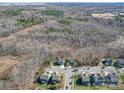 Aerial view of the neighborhood surrounded by trees, showcasing the home's prime location at 7504 Canova Ln # 5, Charlotte, NC 28278