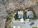 An aerial view captures the home's location and neighborhood, surrounded by lush greenery and mature trees at 7504 Canova Ln # 5, Charlotte, NC 28278