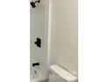Updated bathroom with a white shower and black fixtures and a newer toilet at 111 Dove Cir, Statesville, NC 28625