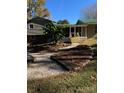 Charming backyard featuring a beautiful walkway, lush tropical plants and ample space for outdoor enjoyment at 121 Alexis Forest Dr, Stanley, NC 28164