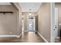 Foyer with hardwood floors, neutral paint, modern lighting, and views of the front yard at 131 Chimney Rock Ct, Denver, NC 28037