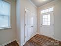 Welcoming foyer featuring hardwood floors, a closet for storage, and natural light at 15040 Cordelia Dr, Charlotte, NC 28278