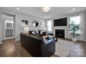 Comfortable living room with modern decor, a fireplace, and plenty of natural light at 187 Tetcott St, Mooresville, NC 28115