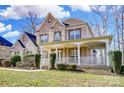 Beautiful brick home with a classic covered front porch and well-maintained yard at 2689 Wingrave Nw St, Concord, NC 28027