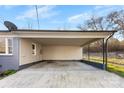 Spacious carport with concrete floor and space for multiple vehicles, attached to home at 2729 Springbrook Cir, Gastonia, NC 28052