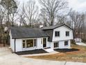 Charming two-story home with white brick, black trim, and a welcoming front entrance at 301 Dollar Cir, Charlotte, NC 28270