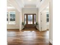 Bright foyer with hardwood floors, a decorative door, and ample natural light flowing through large windows at 326 Lewis Ferry Rd, Statesville, NC 28677