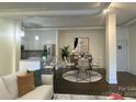 This open-concept layout showcases a dining area adjacent to the kitchen, perfect for modern living at 404 N Laurel Ave # 28, Charlotte, NC 28204