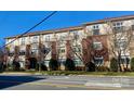 Brick building featuring symmetrical windows and well-maintained landscaping, offering classic architectural charm at 404 N Laurel Ave # 28, Charlotte, NC 28204