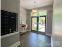 Welcoming lobby featuring neutral tones, tiled floors, and exterior view through glass doors at 404 N Laurel Ave # 28, Charlotte, NC 28204
