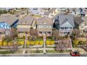 An aerial view of a neighborhood showcases well-maintained homes with lush landscaping and tree-lined streets at 415 Vintage Hill Ln, Huntersville, NC 28078