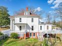 Charming two-story home with a raised deck, brick foundation, and traditional design at 505 Camden Rd, Wadesboro, NC 28170