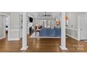 Bright living room with a vaulted ceiling, fireplace, and access to the backyard at 5618 Camilla Dr, Charlotte, NC 28226