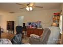 Cozy living room with ceiling fan and comfortable seating at 648 E Ketchie St, China Grove, NC 28023