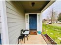 Inviting front porch featuring a cozy seating area and charming decor at 7204 Cranswick Pl, Charlotte, NC 28227