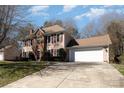Well-maintained home with an attached two-car garage, set on a spacious lot, with a lush green lawn at 7435 Trotter Rd, Charlotte, NC 28216