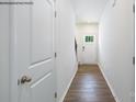 Inviting entryway featuring hardwood floors, white walls, and a classic front door with glass panels at 1014 Hostler Ln, York, SC 29745