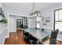 Stylish dining room showcasing hardwood floors, modern lighting fixtures, and large windows for plenty of light at 126 Anchor Ln, Troutman, NC 28166