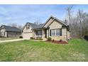 Inviting exterior view of a brick home with a manicured lawn and cozy front porch at 12889 Hill Pine Rd, Midland, NC 28107