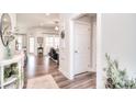 Bright living room with hardwood floors, flowing into the kitchen, and ample natural light at 12889 Hill Pine Rd, Midland, NC 28107