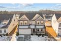 An aerial perspective of a two-story home showcasing its well-manicured surroundings and neighborhood setting at 163 W Heart Pine Ln # 51, Statesville, NC 28677