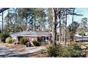 Lovely brick home featuring a well-maintained exterior, inviting entrance and mature landscaping at 1738 Matheson Ave, Charlotte, NC 28205