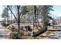 A charming brick home with a fenced yard, mature trees, and a well-maintained exterior at 1738 Matheson Ave, Charlotte, NC 28205