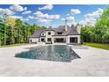 Gorgeous backyard featuring an in-ground pool, hot tub and tiled patio, perfect for outdoor entertaining at 211 Sugar Maple Ln, Weddington, NC 28104