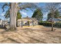 Beautiful blue home with a well-manicured lawn and light wood shutters at 2137 Highland St, Charlotte, NC 28208