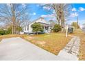 Charming home with a long driveway, lush landscaping, and inviting front porch at 216 Blackwelder St, Kannapolis, NC 28081