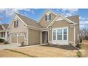 Well-maintained home featuring brick and siding accents, attached garage, and manicured front lawn at 4018 Moxie Way, Charlotte, NC 28215
