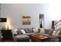 Spacious living room showcasing a sectional sofa, hardwood floors, and ample natural light at 522 Sarazen Way, Salisbury, NC 28144