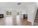 Open-concept living space with fireplace, hardwood floors, and views of the outdoors at 878 Two Brothers Ln, York, SC 29745