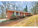 This beautiful brick home shows a large bay window and an extended driveway at 1069 W Rebound Rd, Van Wyck, SC 29720