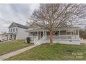 A quaint home with a covered porch perfect for enjoying the neighborhood views at 116 11Th St, Spencer, NC 28159