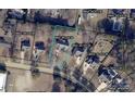 An aerial view of a home and neighborhood showing the property outlined in blue at 1200 Craig Ave, Lancaster, SC 29720