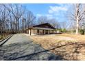 Charming home with a long porch and lots of trees at 13124 Lemmond Dr, Matthews, NC 28105