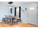 Dining room with natural light, wooden table with seating for four, and hardwood floors at 1345 Beagle Run, Salisbury, NC 28146