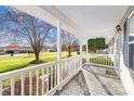 Covered front porch with wood decking and painted railings at 341 Massey Deal Rd, Statesville, NC 28625