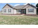 Close up of inviting home featuring a manicured lawn and tidy landscaping at 430 Cress School Rd, Salisbury, NC 28147