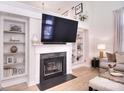 Cozy living room boasts a fireplace with built-ins, offering a perfect blend of style and comfort at 4860 S Hill View Dr, Charlotte, NC 28210