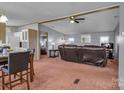 Spacious living room with a large brown leather sofa and views into kitchen and bedroom at 524 Damascus Church Rd, Statesville, NC 28625