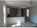 Bright kitchen featuring a breakfast bar, modern fixtures, and natural light at 635 Acre Ct, York, SC 29745