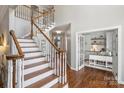 Bright foyer with hardwood floors, staircase and view to office at 9627 Baileywick Rd, Charlotte, NC 28277