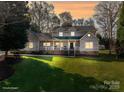 Charming home featuring a well-manicured lawn and a classic covered front porch, ideal for relaxing evenings at 107 Doris Ct, Lincolnton, NC 28092