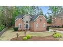 Charming two-story brick and stone home with well-manicured lawn and lush landscaping at 109 Stirling Heights Ln, Fort Mill, SC 29715