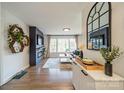 Bright living room with a modern fireplace, stylish decor, and plenty of natural light at 1310 Seneca Pl, Charlotte, NC 28209