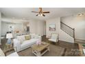 Inviting living room showcasing an open floor plan, hardwood floors, and comfortable furnishings at 176 Cherry Birch St, Mooresville, NC 28117