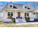 Inviting front porch with stylish seating and a prominent house number at 176 Chestnut Ln, Gastonia, NC 28052