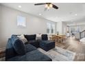 Open floor plan with hardwood floors, recessed lighting, and a modern dining table at 2132 Electric Ln, Charlotte, NC 28205